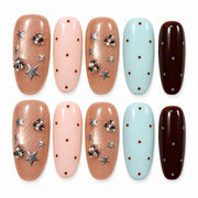 Pastel Galaxy pastel blue, pink and chocolate brown star medium oval press-on nails
