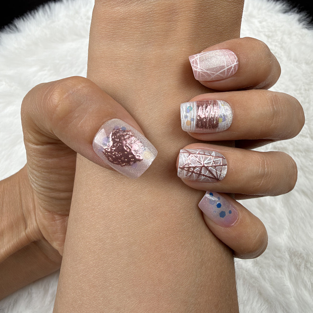 Close-up of hands wearing Pastel Sketch pastel abstract line art square press-on nails