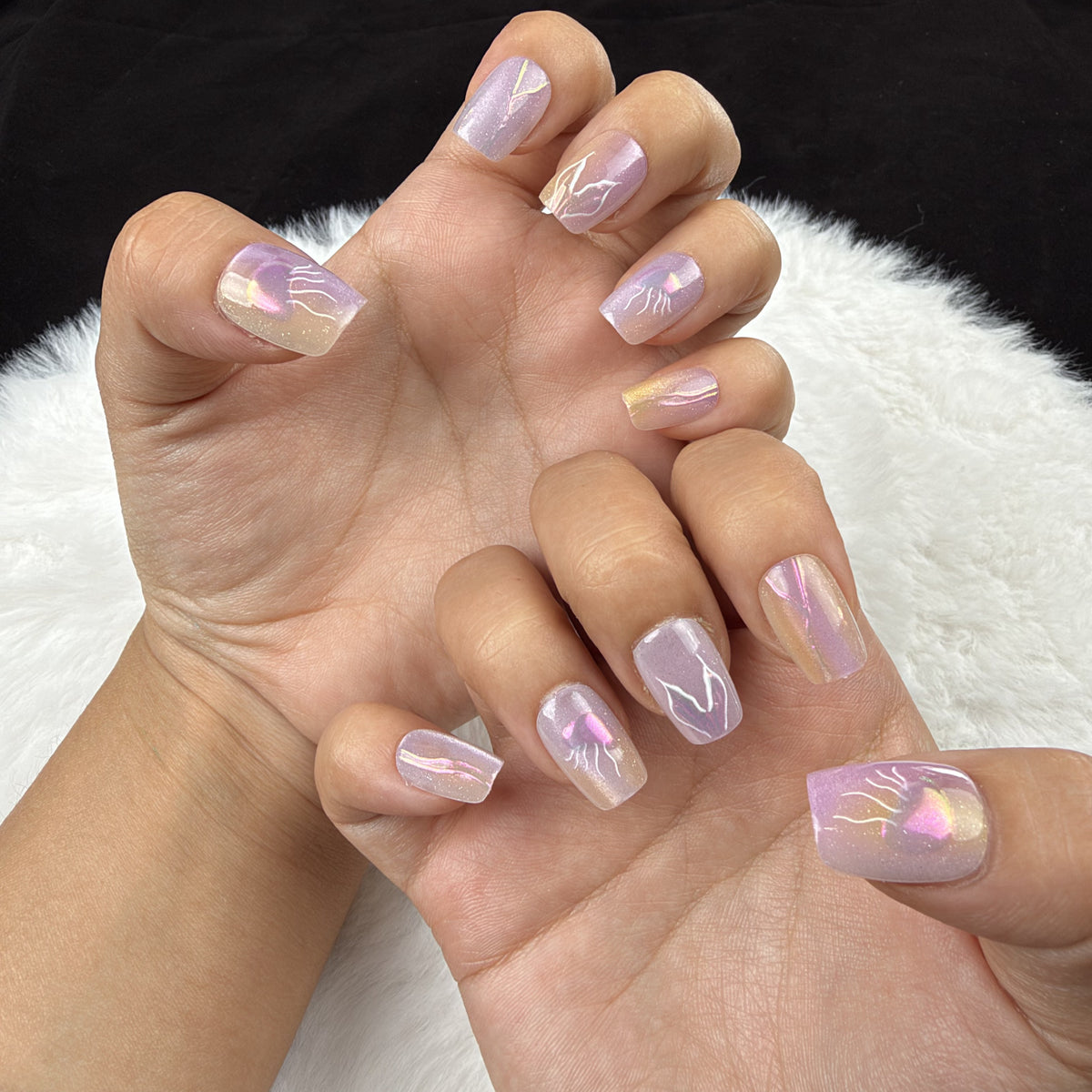 Hands wearing Lavender Flash lavender iridescent abstract square press-on nails