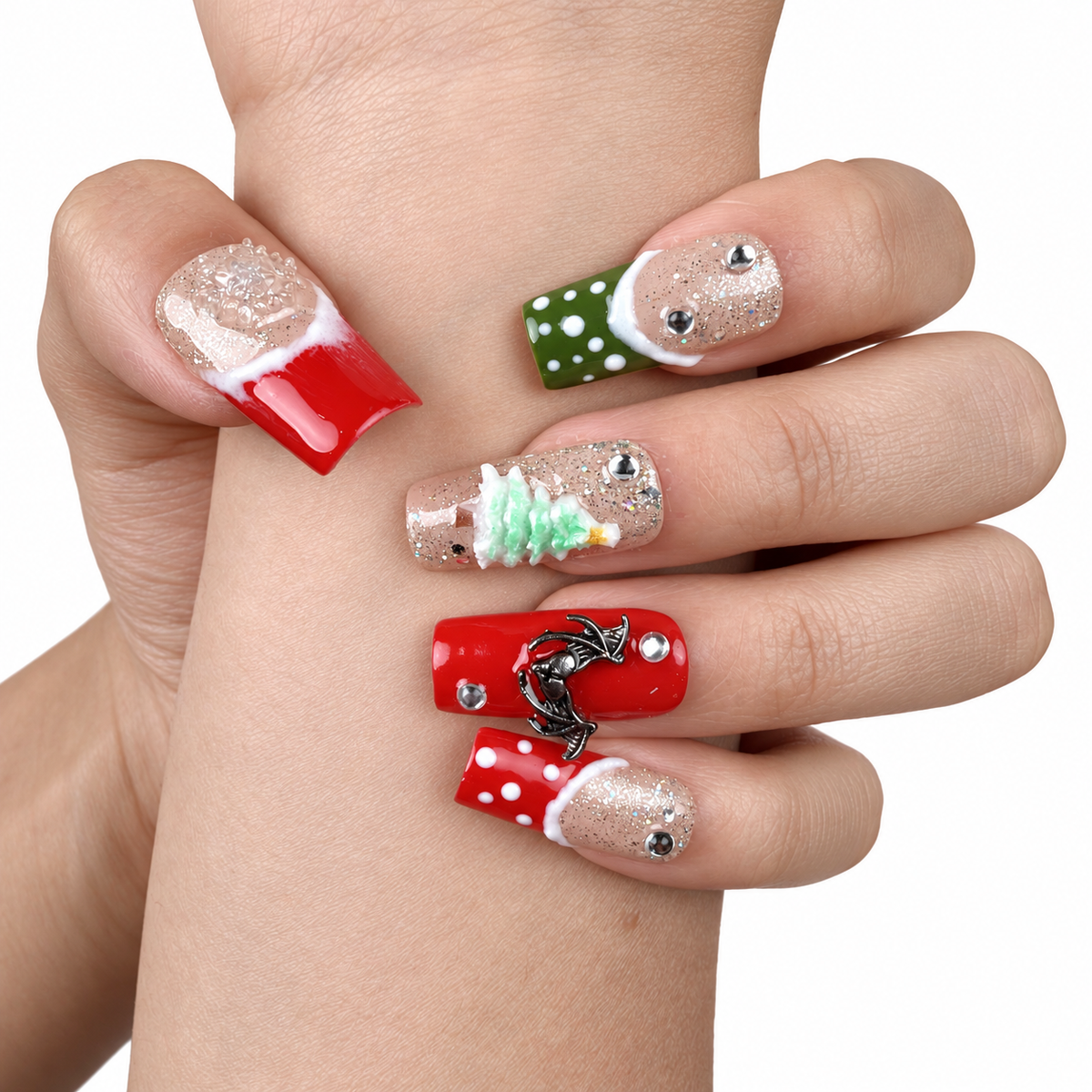 Detail shot of Gingerbread Party red, green and glitter Christmas square press-on nails with gingerbread and tree designs on hand