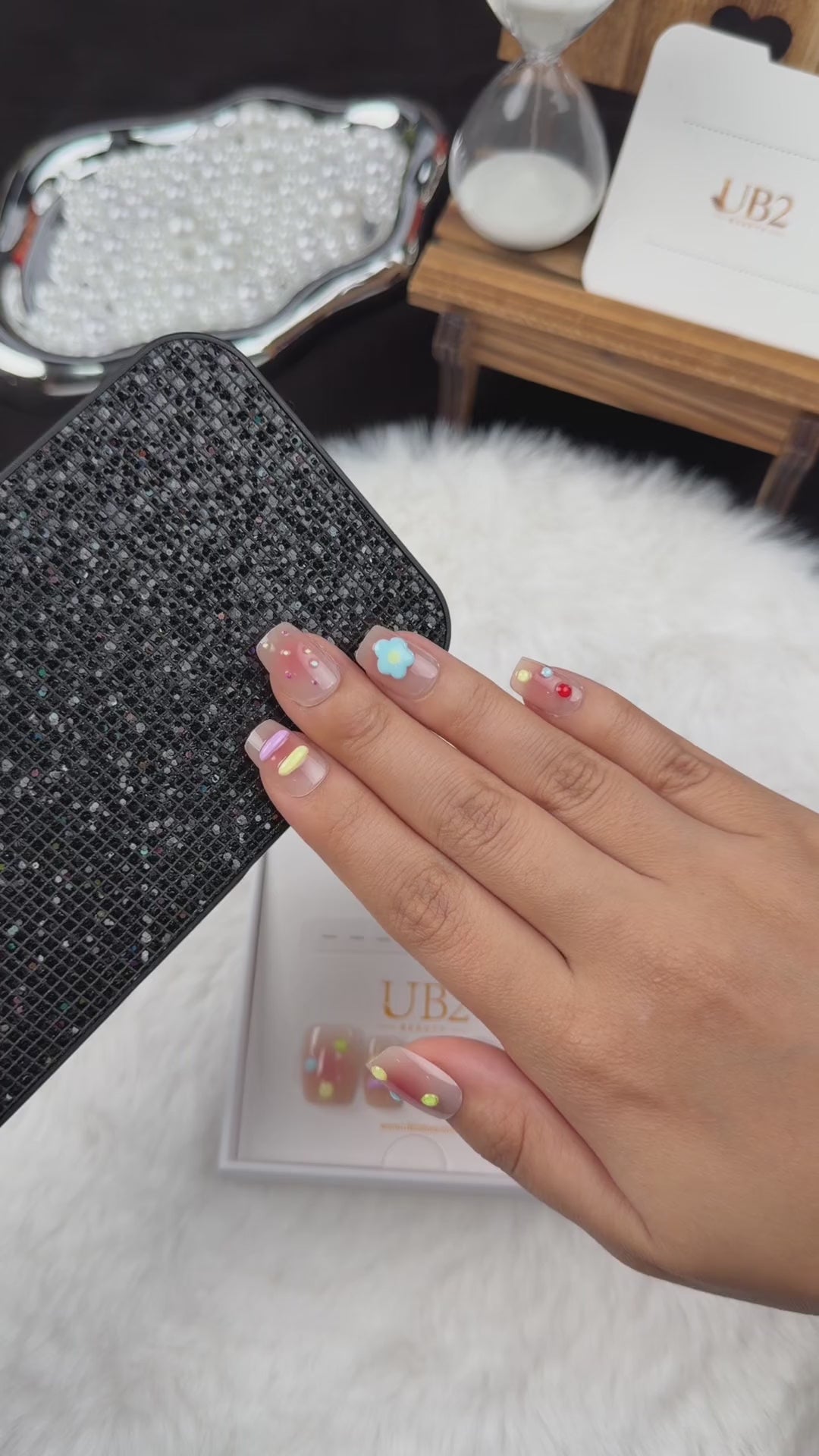 Load video: Step-by-step application of Candy Garden pastel square press-on nails with blue flower accents