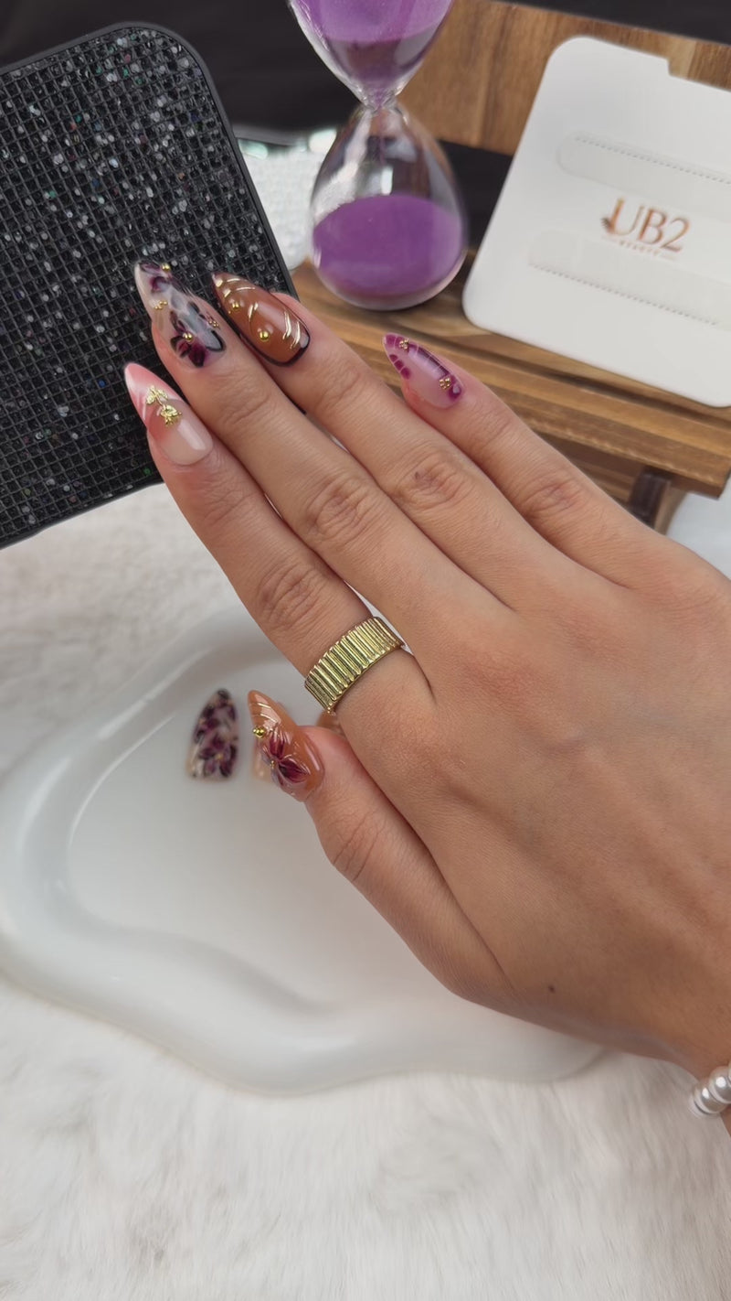 Step-by-step application of Autumn Petals amber, blush pink and wine red floral almond press-on nails