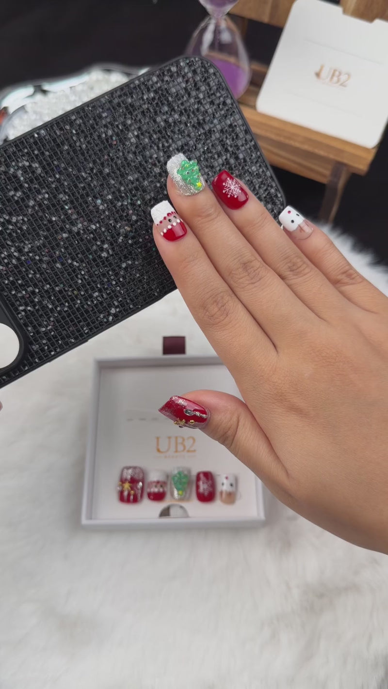 Step-by-step application of Christmas Patchwork red and green Christmas square press-on nails with trees and snowflakes