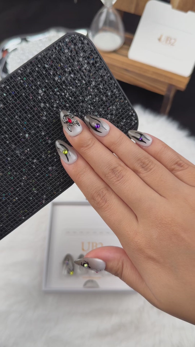 Step-by-step application of Midnight Creepers grey spider Halloween almond press-on nails