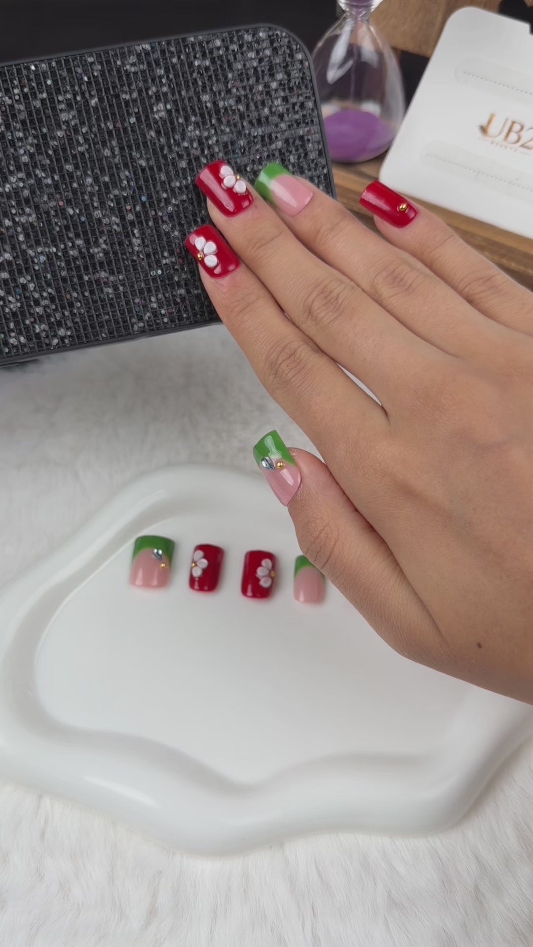 Load video: Step-by-step application of Garden Contrast red, green and white floral square press-on nails