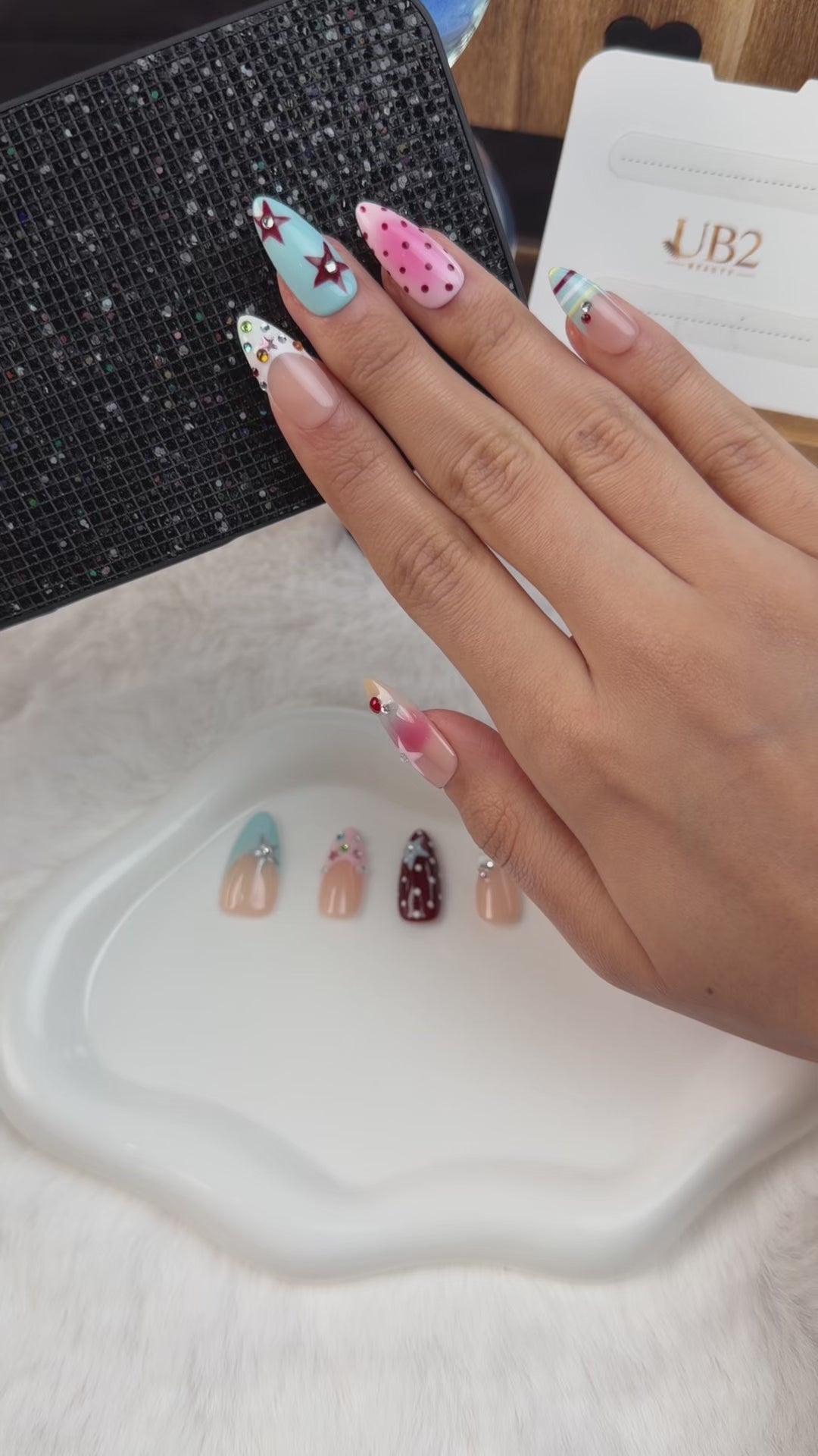 Load video: Step-by-step application of Rainbow pastel graphic accent almond press-on nails