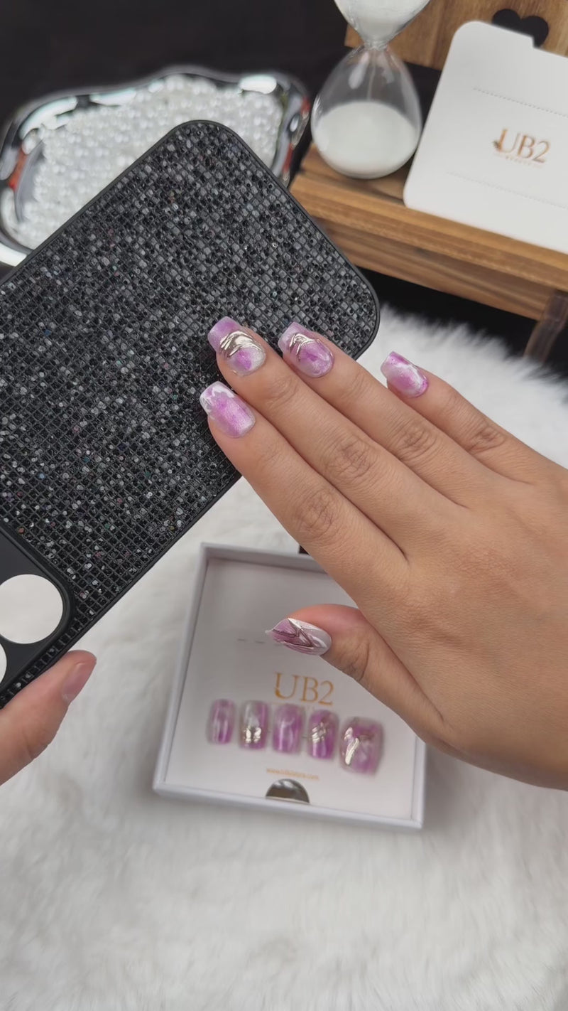 Step-by-step application of Orchid Marble purple marble square press-on nails with metallic accents