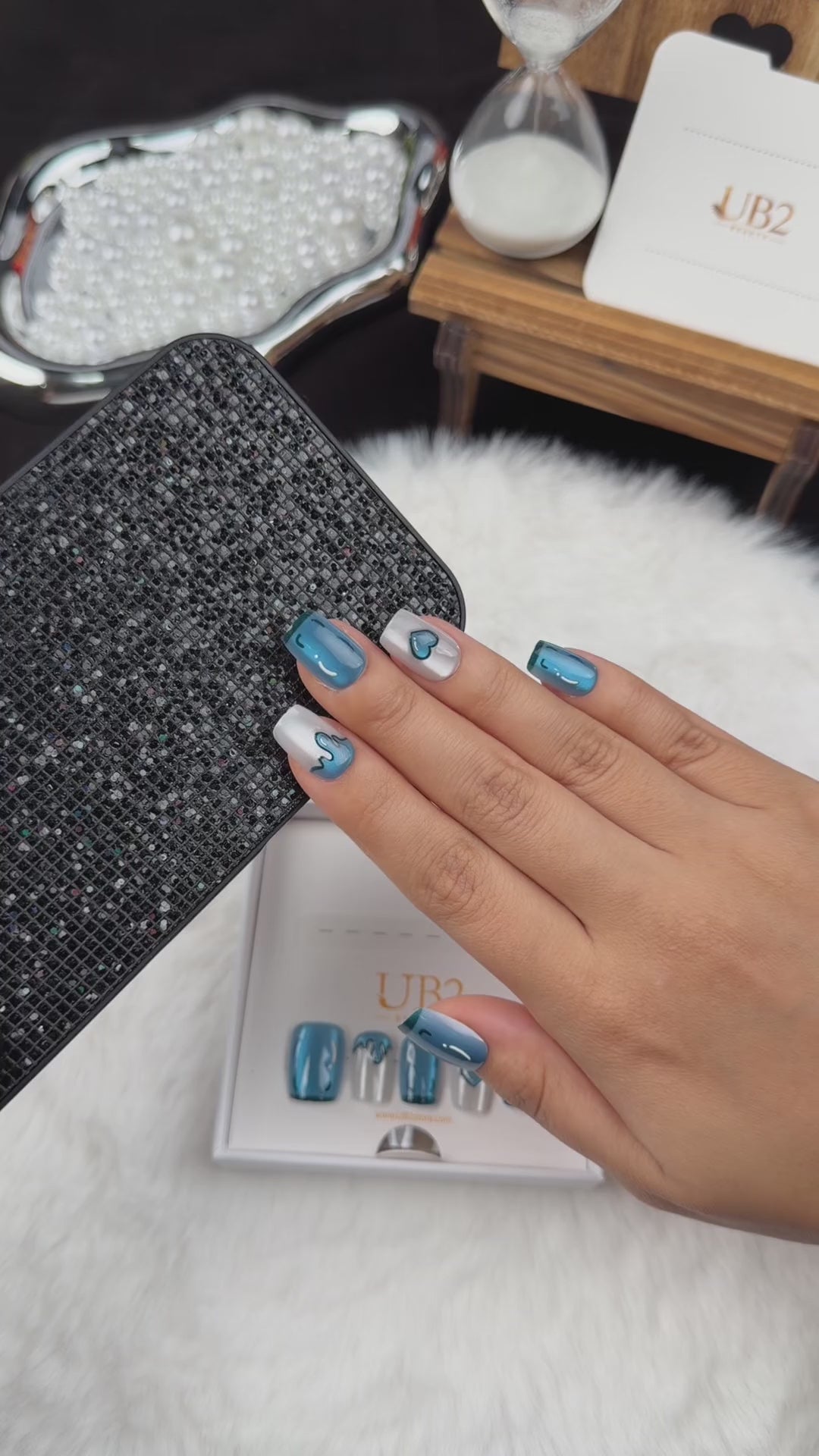 Load video: Step-by-step application of Blue Heart Drip blue chrome and pearl white heart square press-on nails