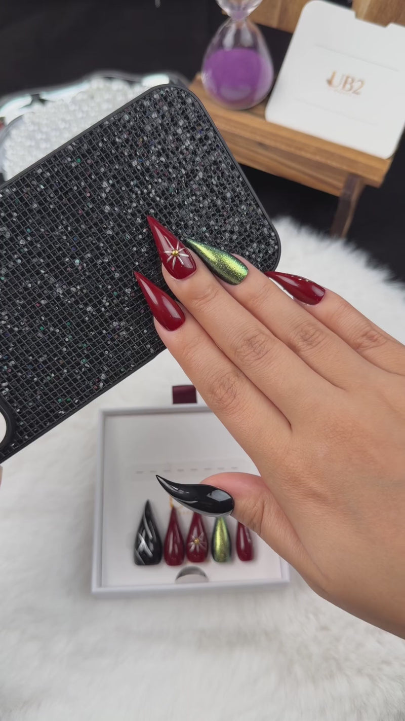Step-by-step application of Ruby Orbit burgundy, green chrome and black star stiletto press-on nails
