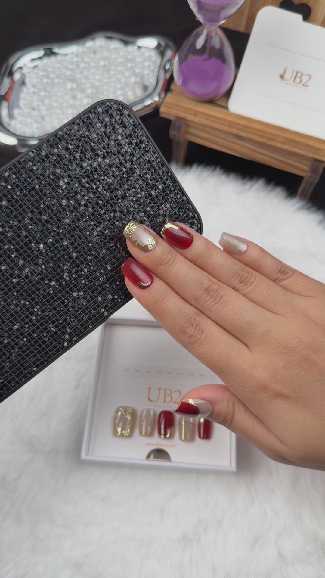 Load video: Step-by-step application of Crimson Frame red and gold-tone square press-on nails