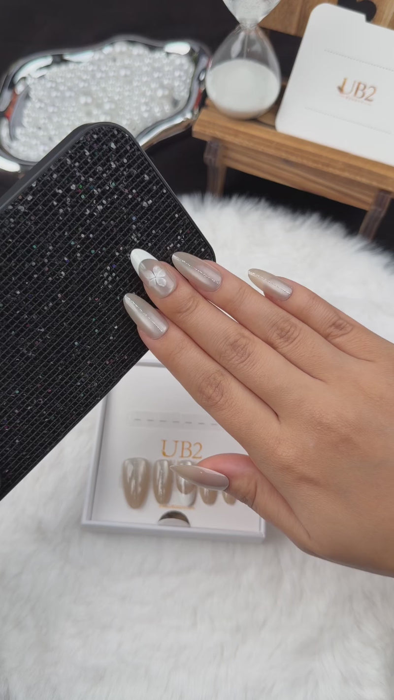 Step-by-step application of Pearl Petal nude pearl French tip almond press-on nails