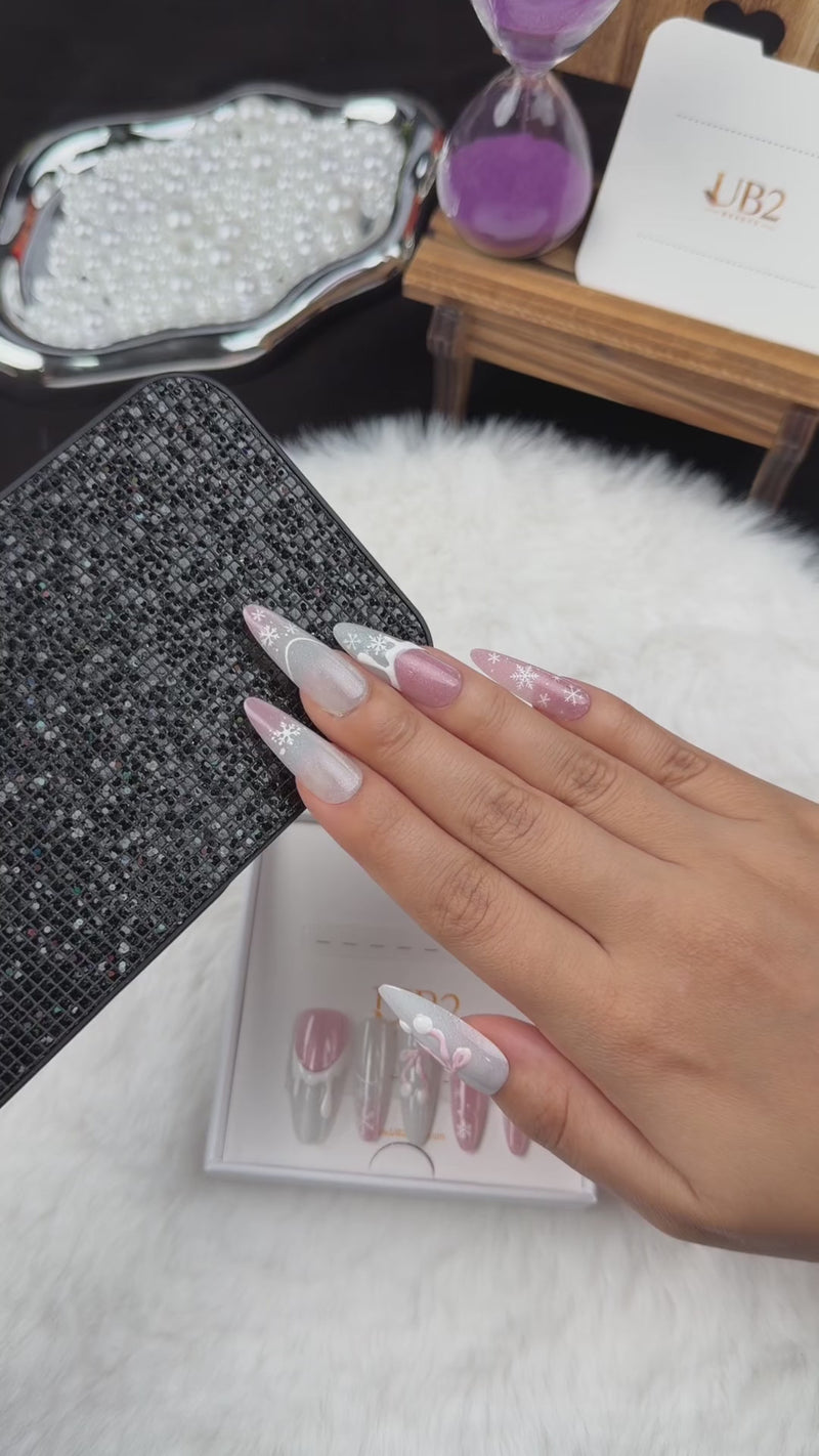 Step-by-step application of Snowdrop Ribbon pink and pearl white Christmas almond press-on nails