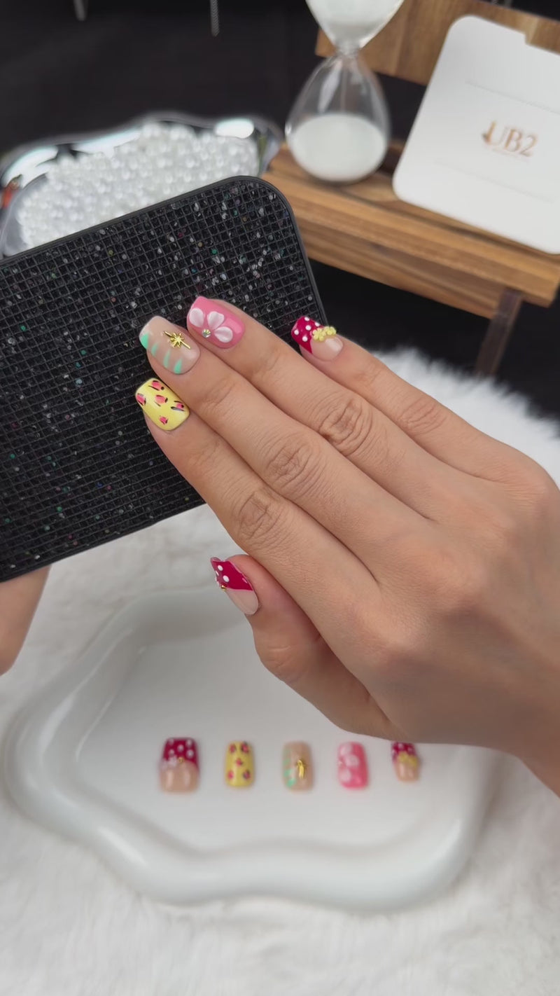 Step-by-step application of Garden Party red, yellow and pink floral square press-on nails