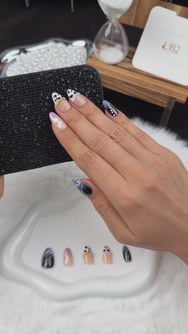 Step-by-step application of Monochrome Meadow black and white floral almond press-on nails