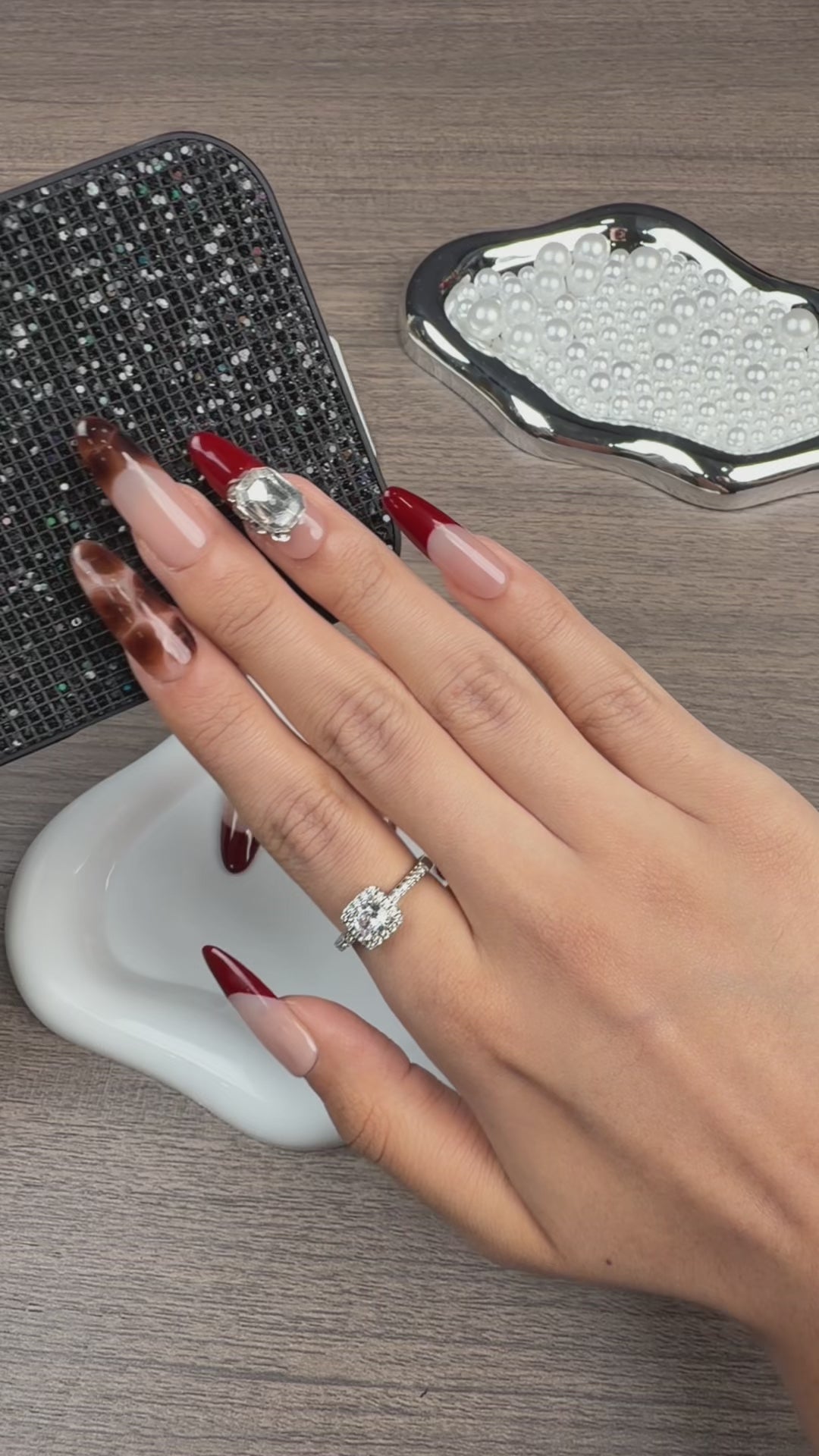Load video: Step-by-step application of Wine Tortoise burgundy tortoiseshell French tip extra-long oval press-on nails