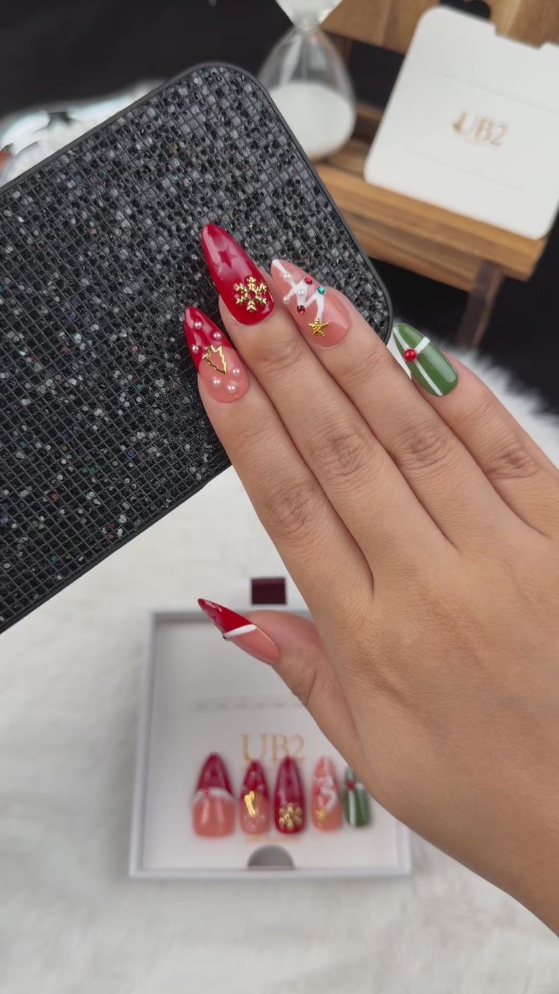 Step-by-step application of Christmas Keepsakes red, green and nude French tip Christmas almond press-on nails