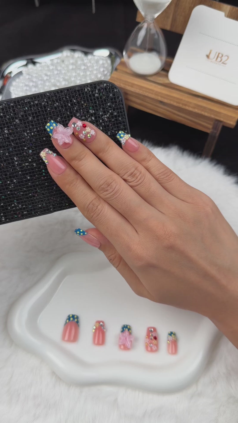 Step-by-step application of Daisy Confetti blue and pink polka dot French tip floral square press-on nails
