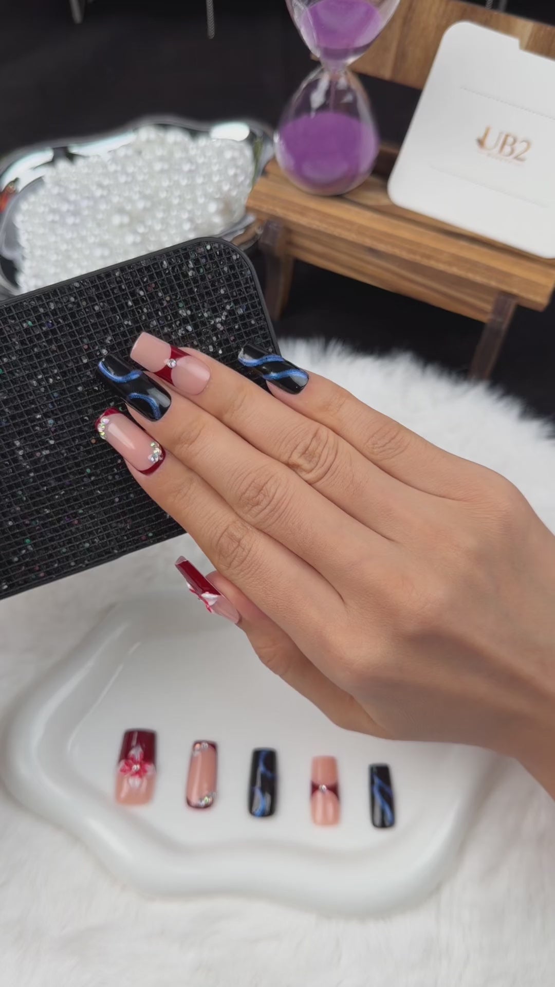 Load video: Step-by-step application of Wine Ribbon burgundy and navy bow square press-on nails