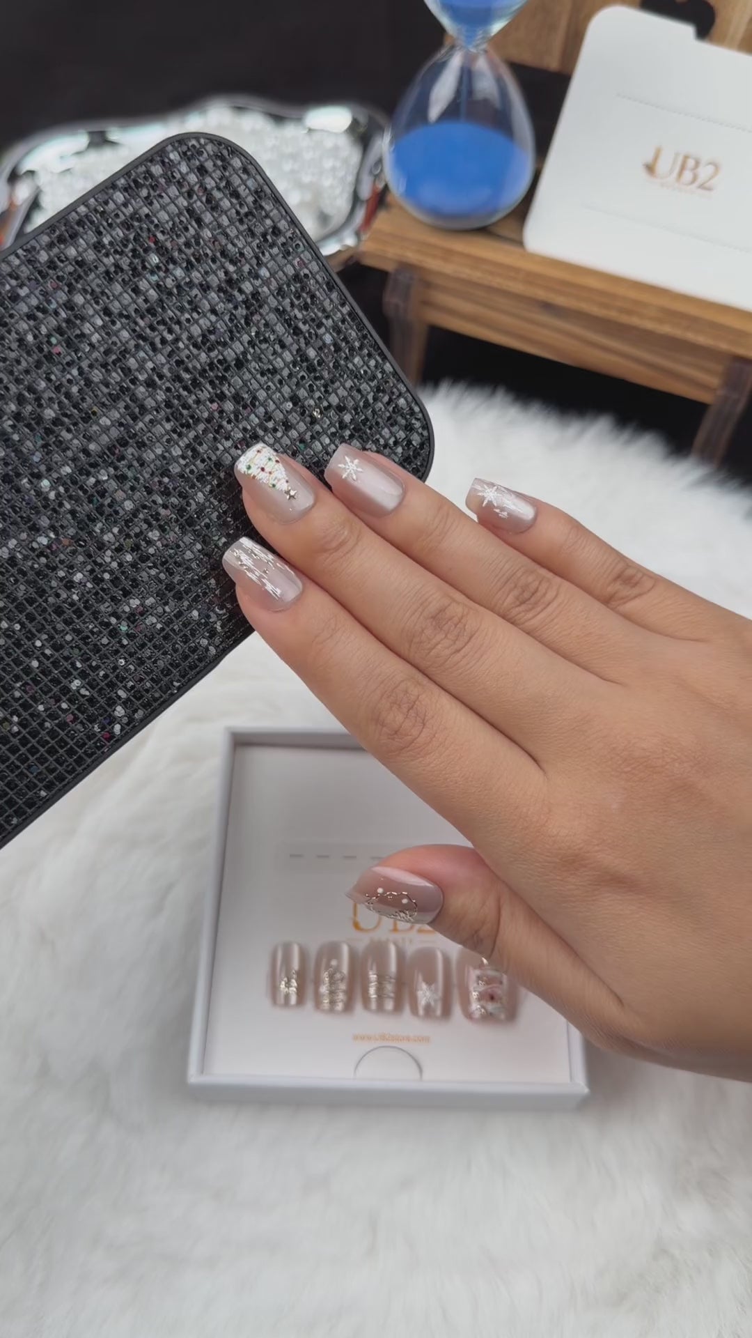 Load video: Step-by-step application of Champagne Fir champagne tree and snowflake Christmas square press-on nails