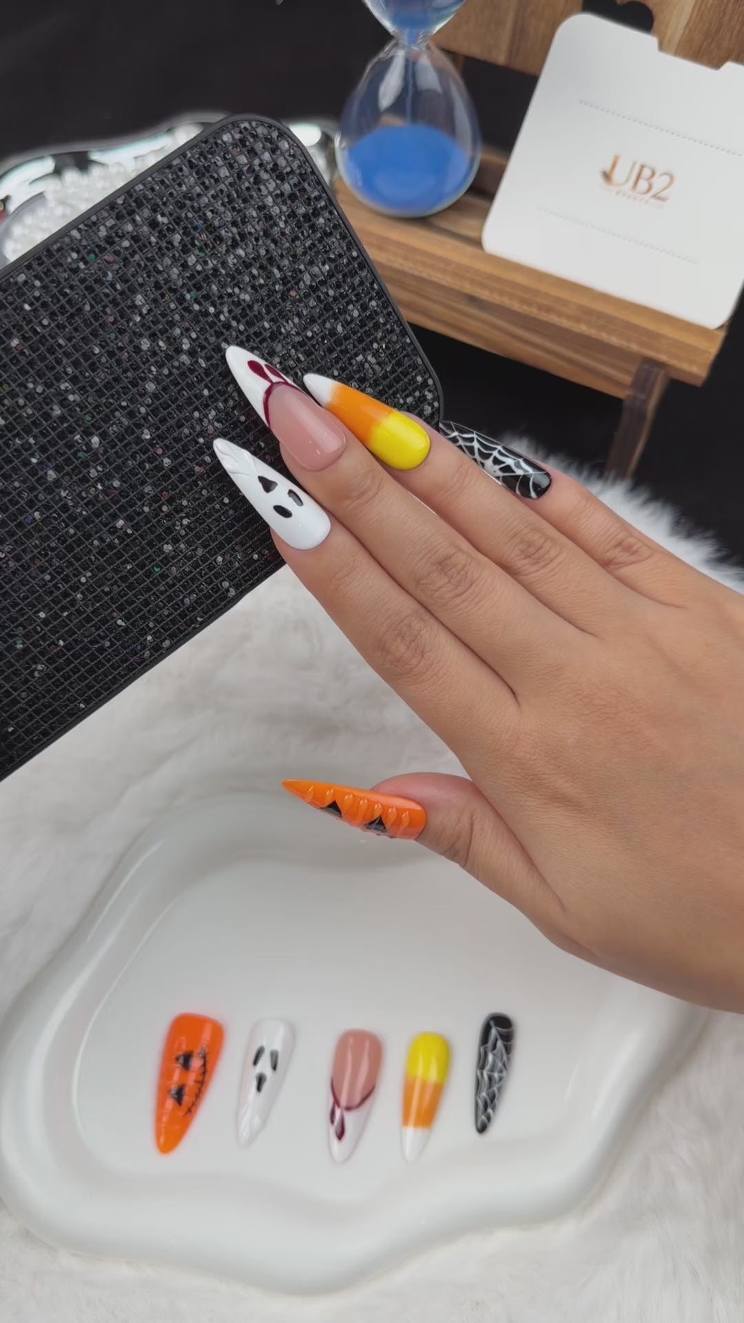Load video: Step-by-step application of Haunted Parade ghost, pumpkin and spiderweb Halloween stiletto press-on nails