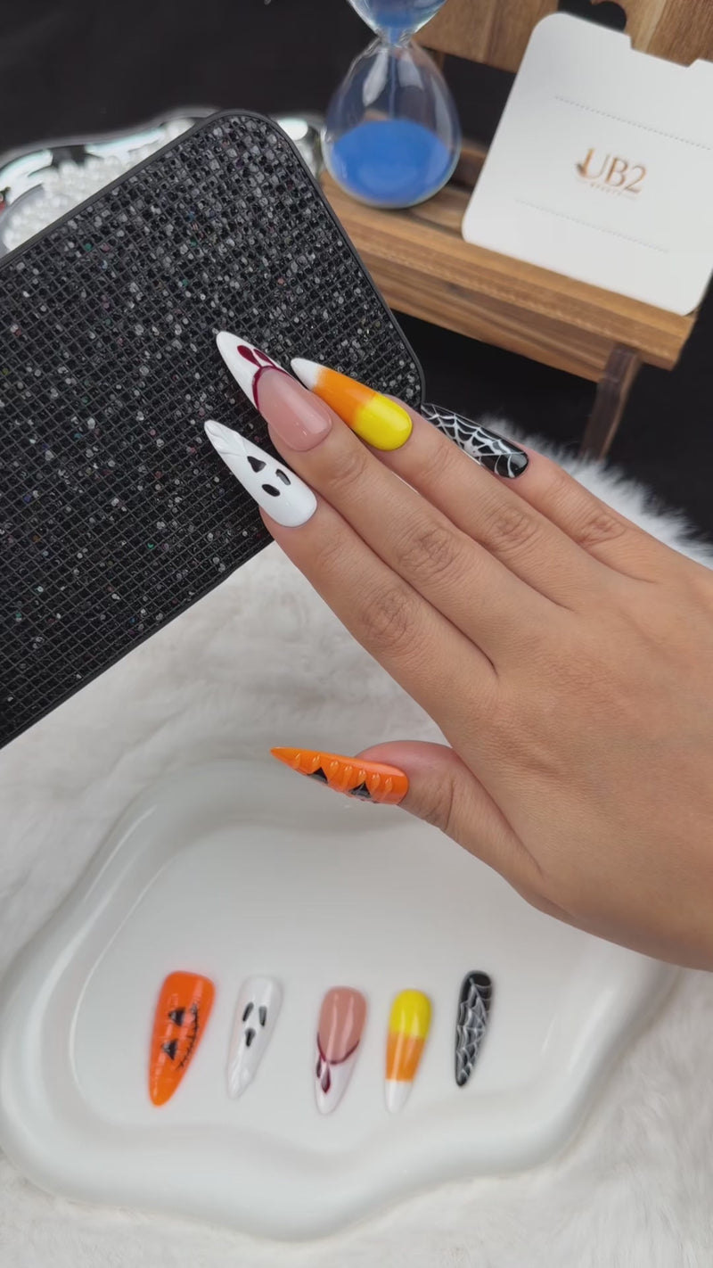 Step-by-step application of Haunted Parade ghost, pumpkin and spiderweb Halloween stiletto press-on nails