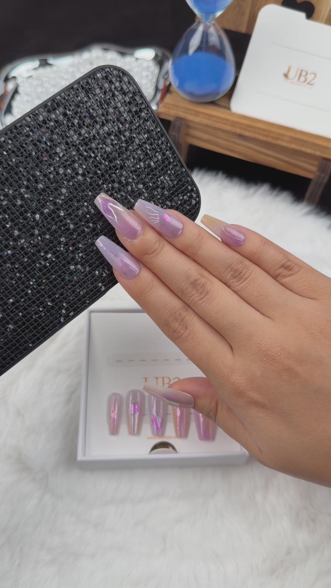 Load video: Step-by-step application of Iris Lightning lavender iridescent abstract coffin press-on nails