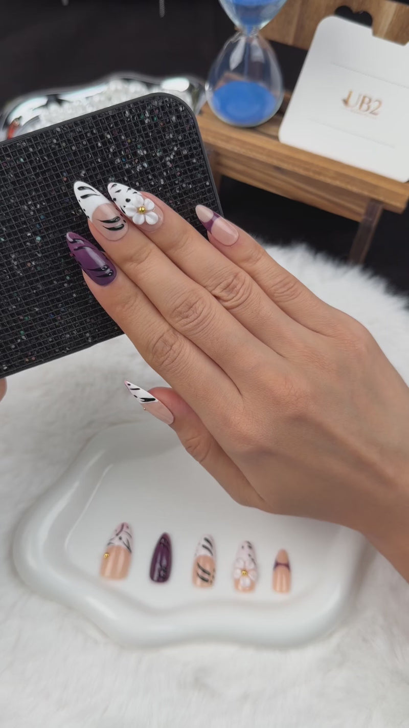 Step-by-step application of Plum Safari plum, black and white zebra print floral almond press-on nails