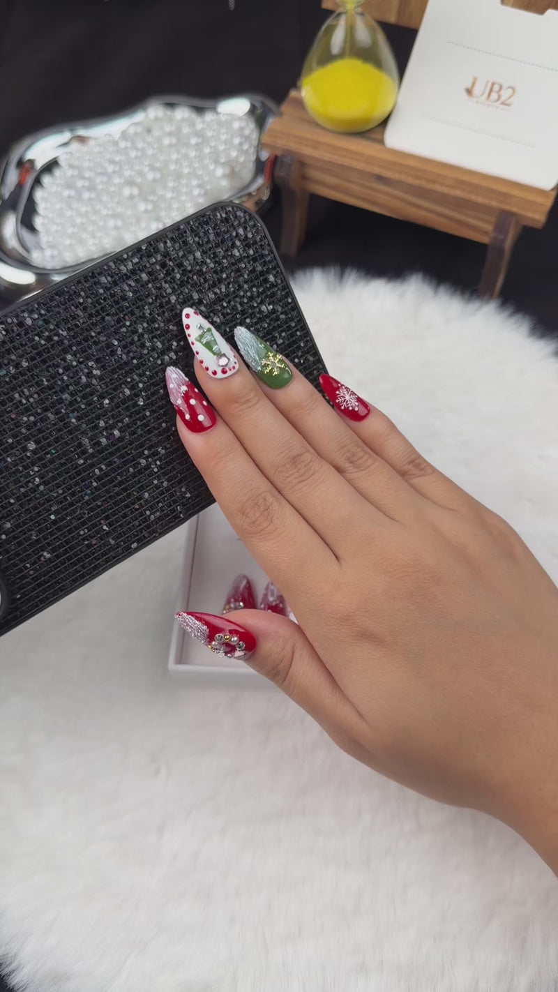 Step-by-step application of Festive Garland red, green and white Christmas almond press-on nails with wreaths and snowflakes