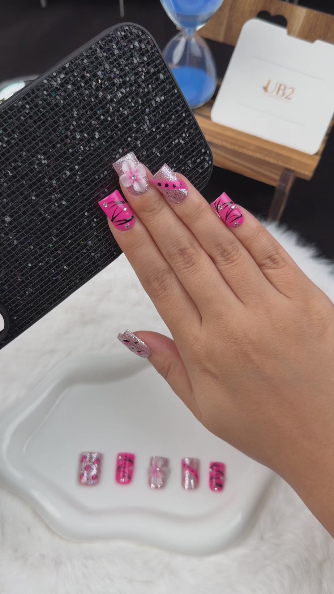 Load video: Step-by-step application of Pink Spark hot pink, black and silver floral square press-on nails