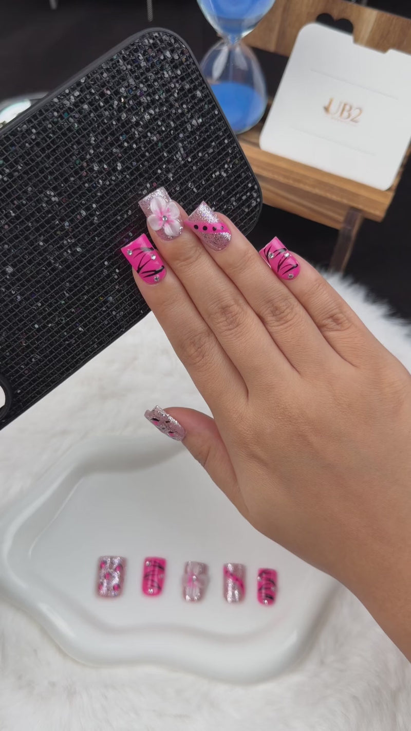 Step-by-step application of Pink Spark hot pink, black and silver floral square press-on nails