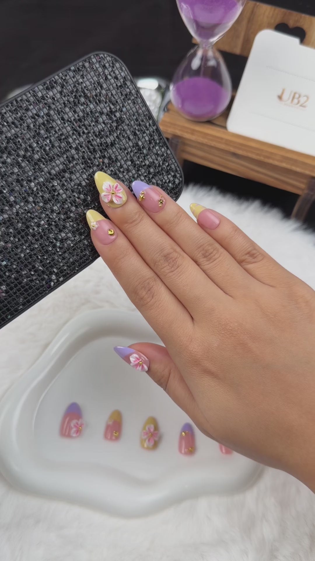 Load video: Step-by-step application of Lilac Lemon lilac and yellow French tip floral almond press-on nails