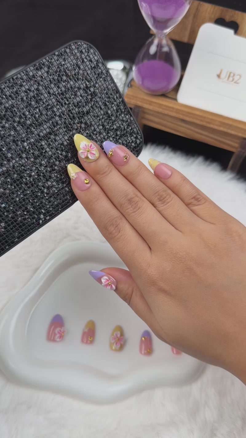 Step-by-step application of Lilac Lemon lilac and yellow French tip floral almond press-on nails