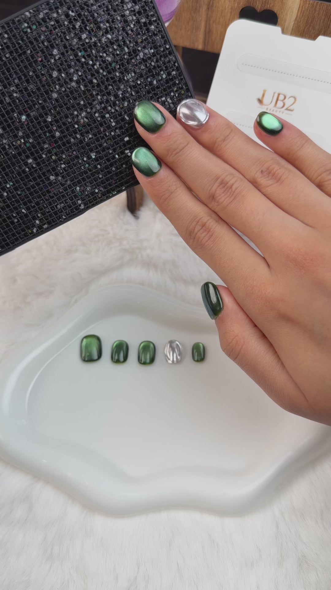 Load video: Step-by-step application of Emerald Mirror green cat eye and silver chrome short squoval press-on nails