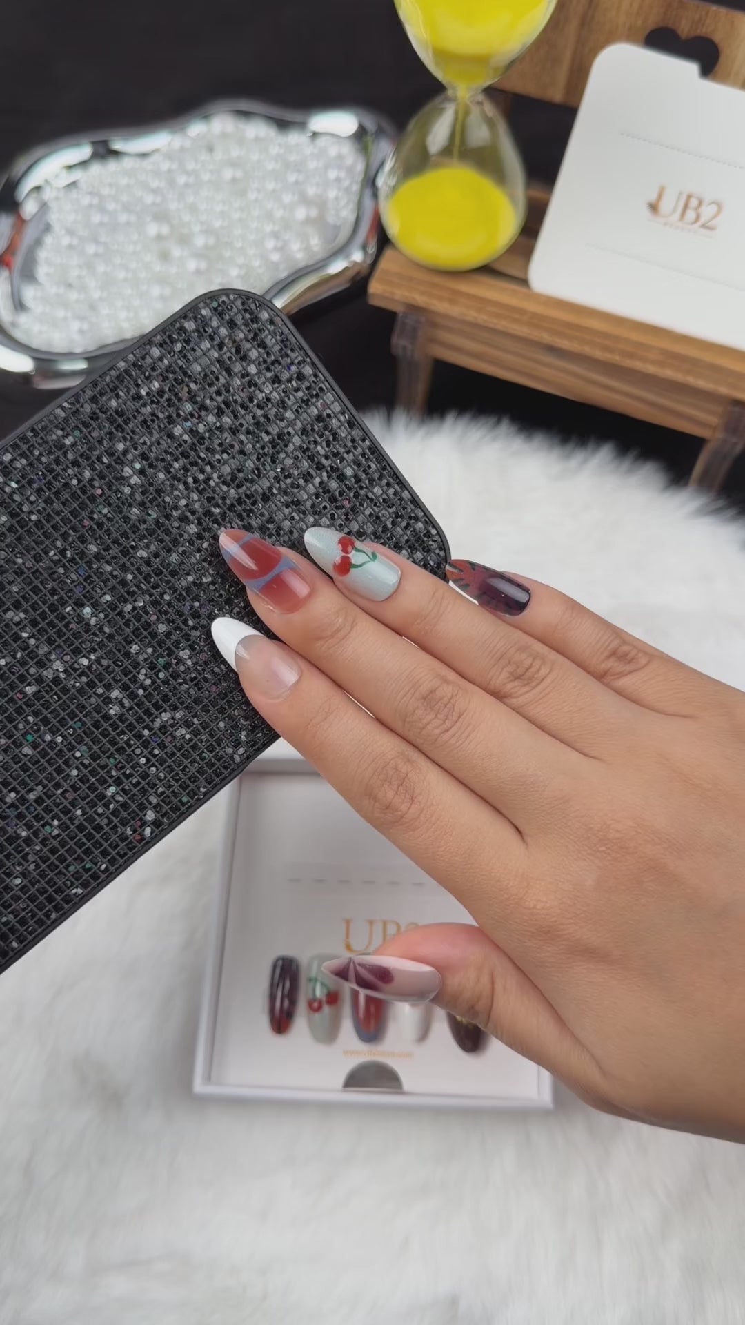 Load video: Step-by-step application of Autumn Picnic plaid, cherry and floral almond press-on nails
