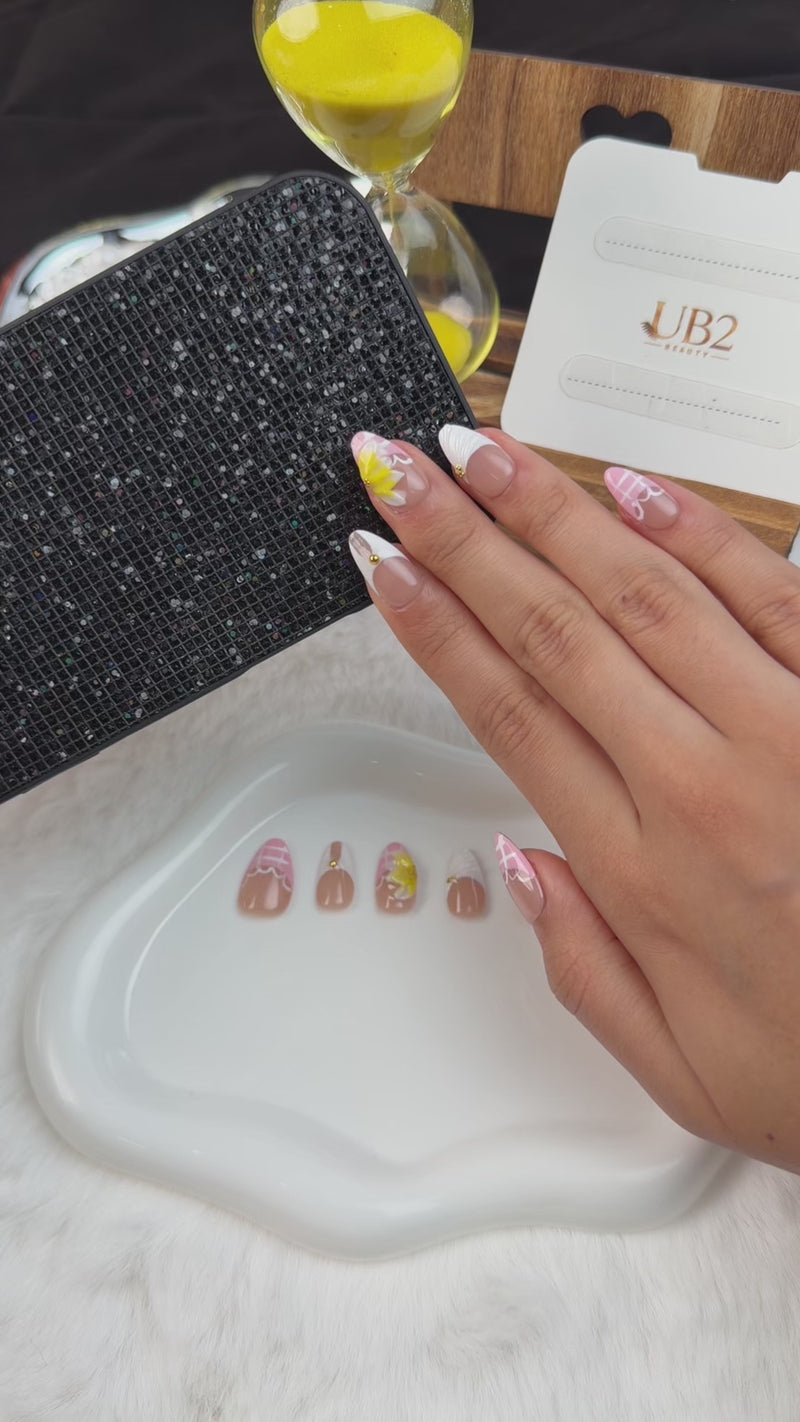 Step-by-step application of Buttercream Bloom pink, white and yellow 3D floral medium almond press-on nails