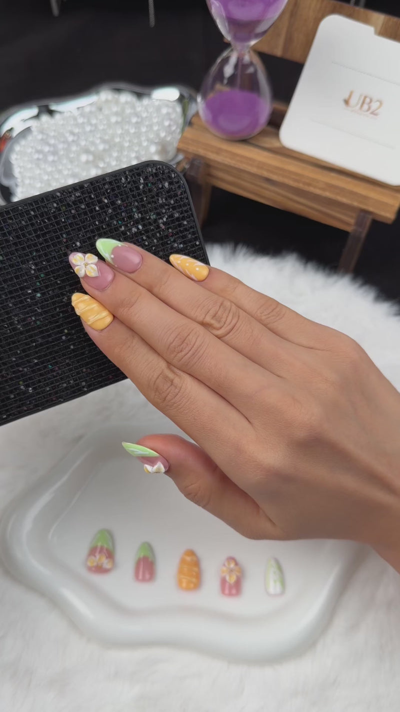 Step-by-step application of Citrus Blossom mint, pink and orange floral almond press-on nails