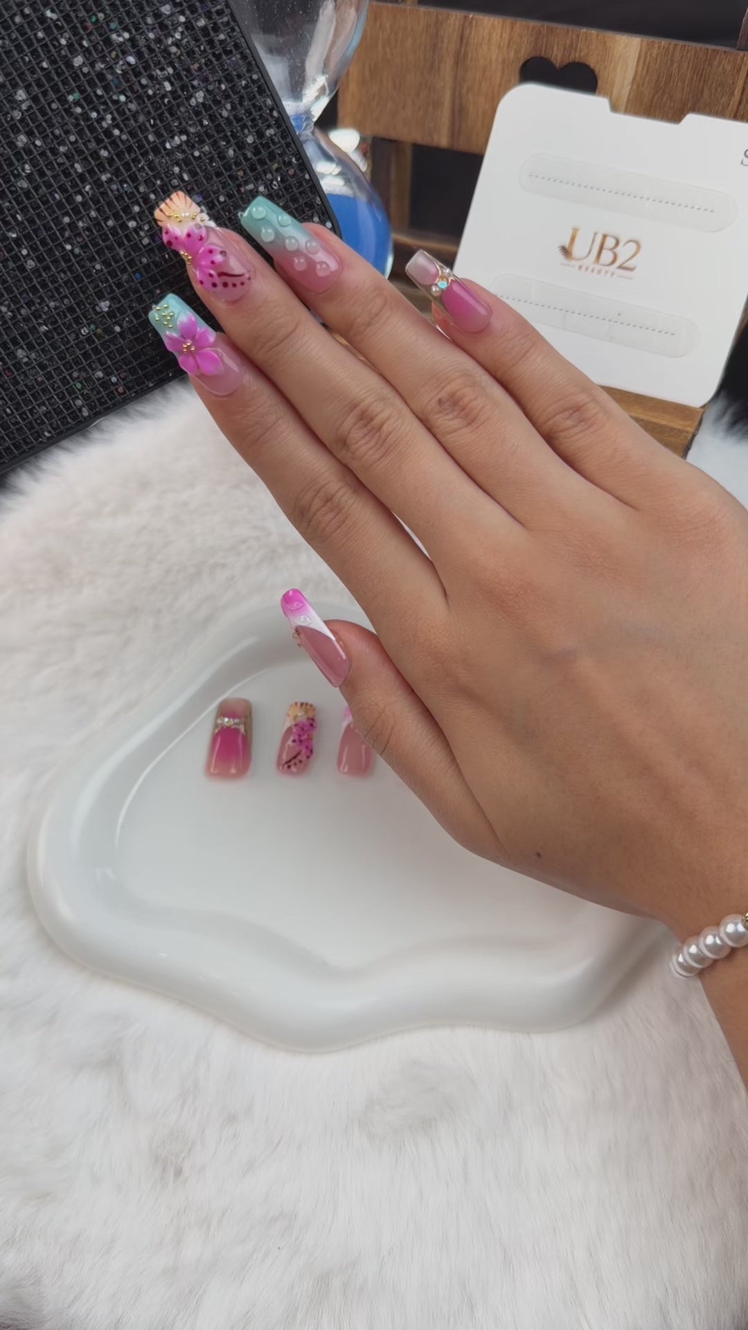 Load video: Step-by-step application of Candy Garden pink and aqua blue 3D floral long square press-on nails