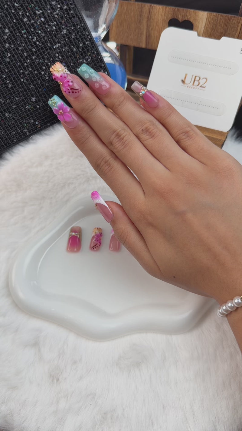 Step-by-step application of Candy Garden pink and aqua blue 3D floral long square press-on nails