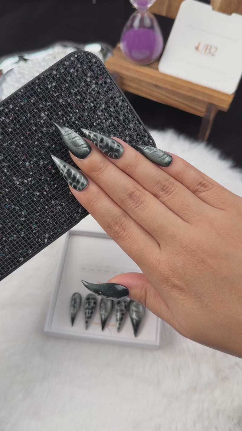 Step-by-step application of Chrome Shadow black and silver chrome stiletto press-on nails