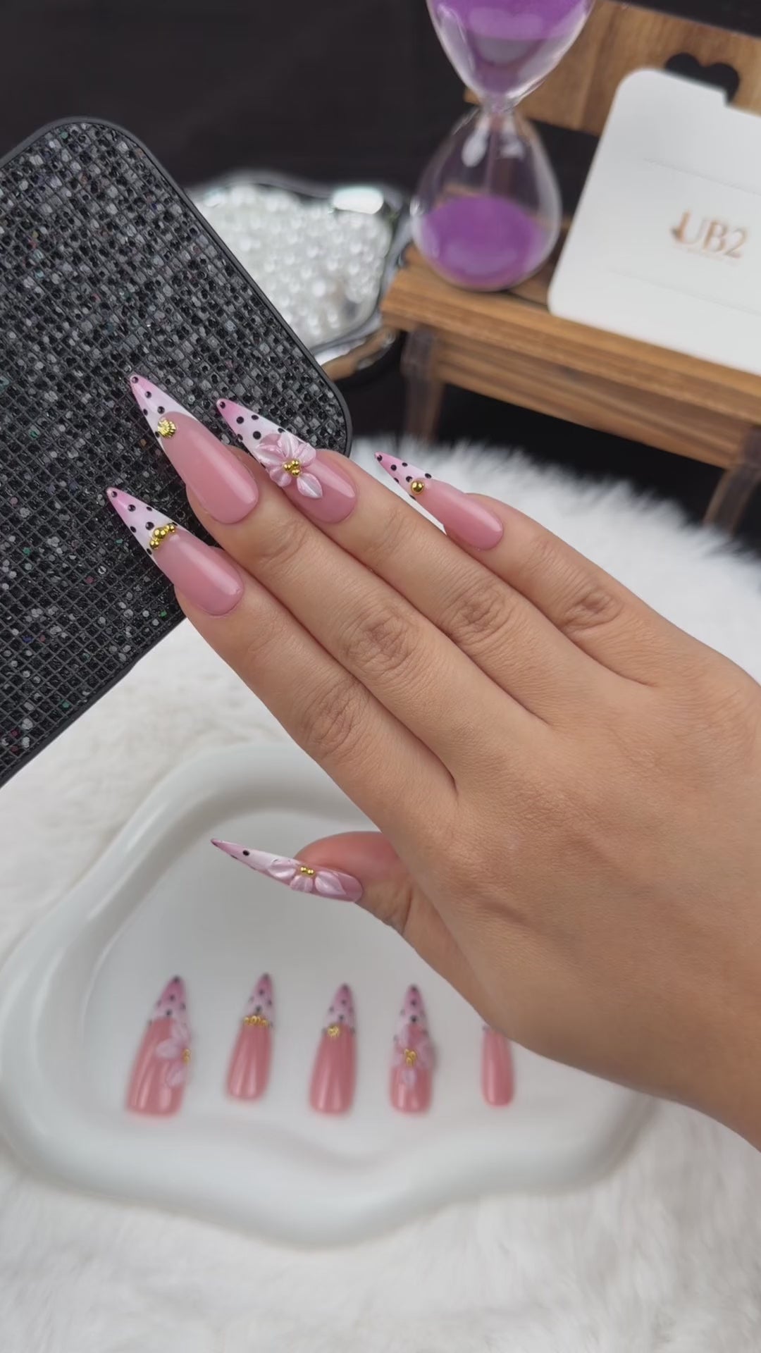 Load video: Step-by-step application of Blush Polka pink polka dot French tip floral almond press-on nails