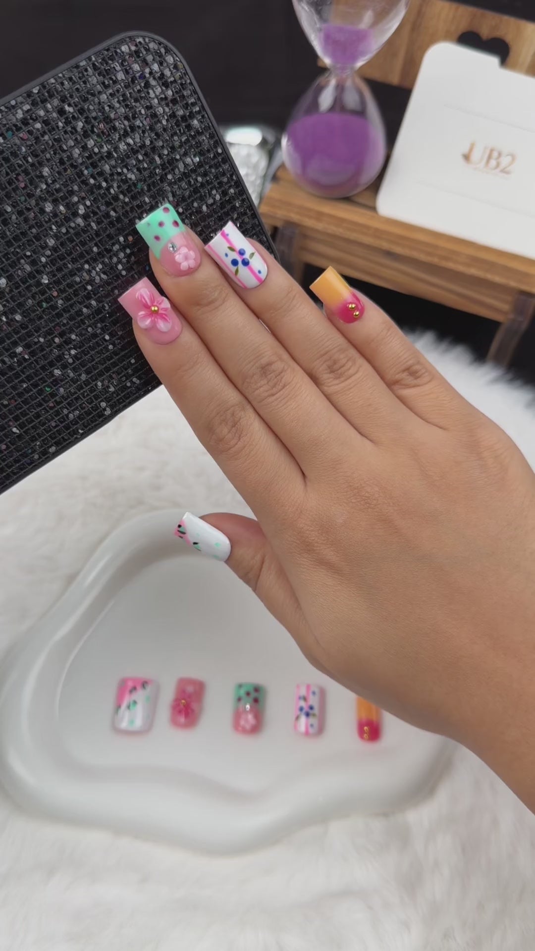 Load video: Step-by-step application of Pastel Flower Mix pink, mint and blue floral square press-on nails