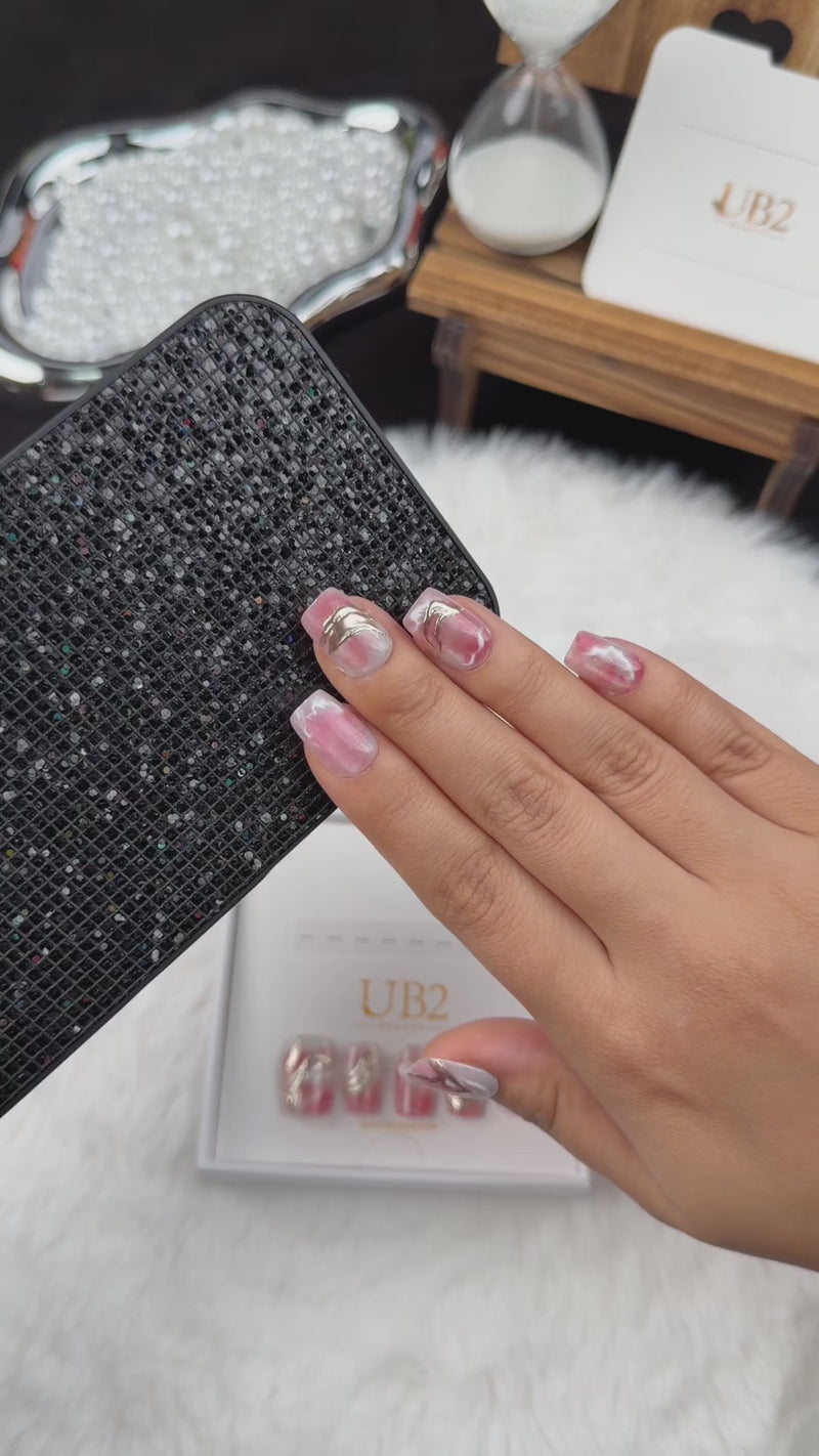 Step-by-step application of Rose Marble pink marble square press-on nails with metallic accents