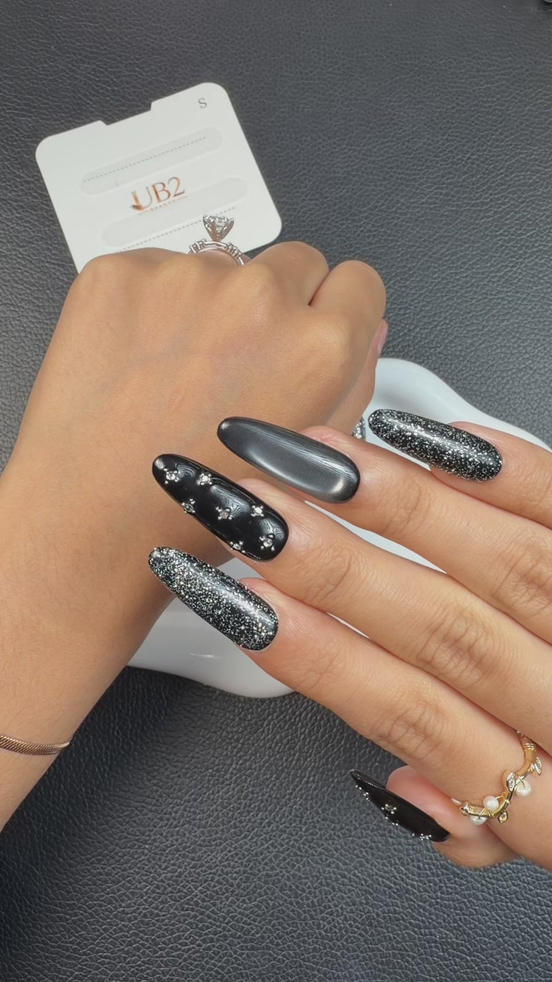 Step-by-step application of Midnight Shimmer black and silver cat eye crystal medium oval press-on nails