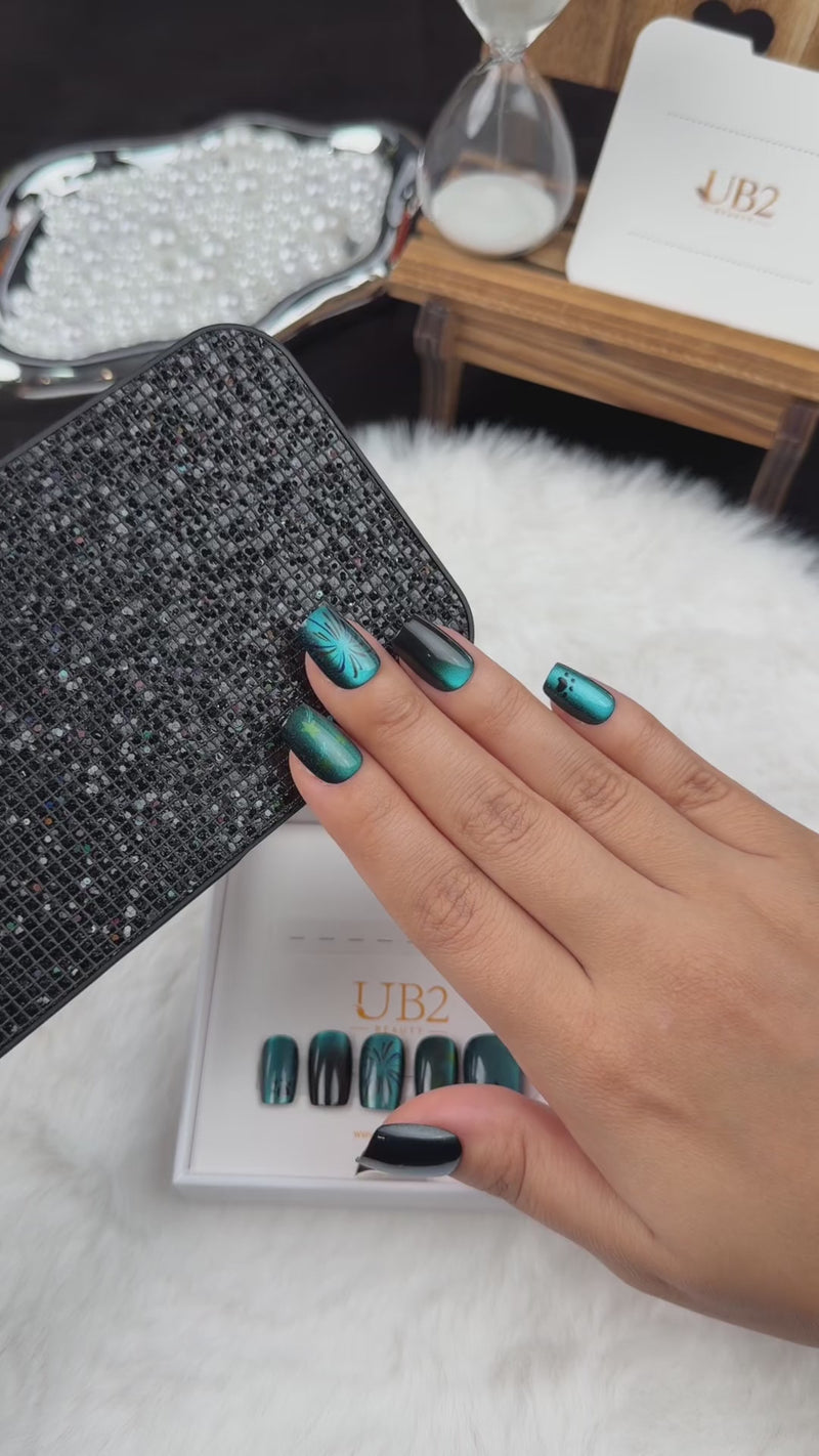 Step-by-step application of Ocean Afterglow teal and black cat eye square press-on nails