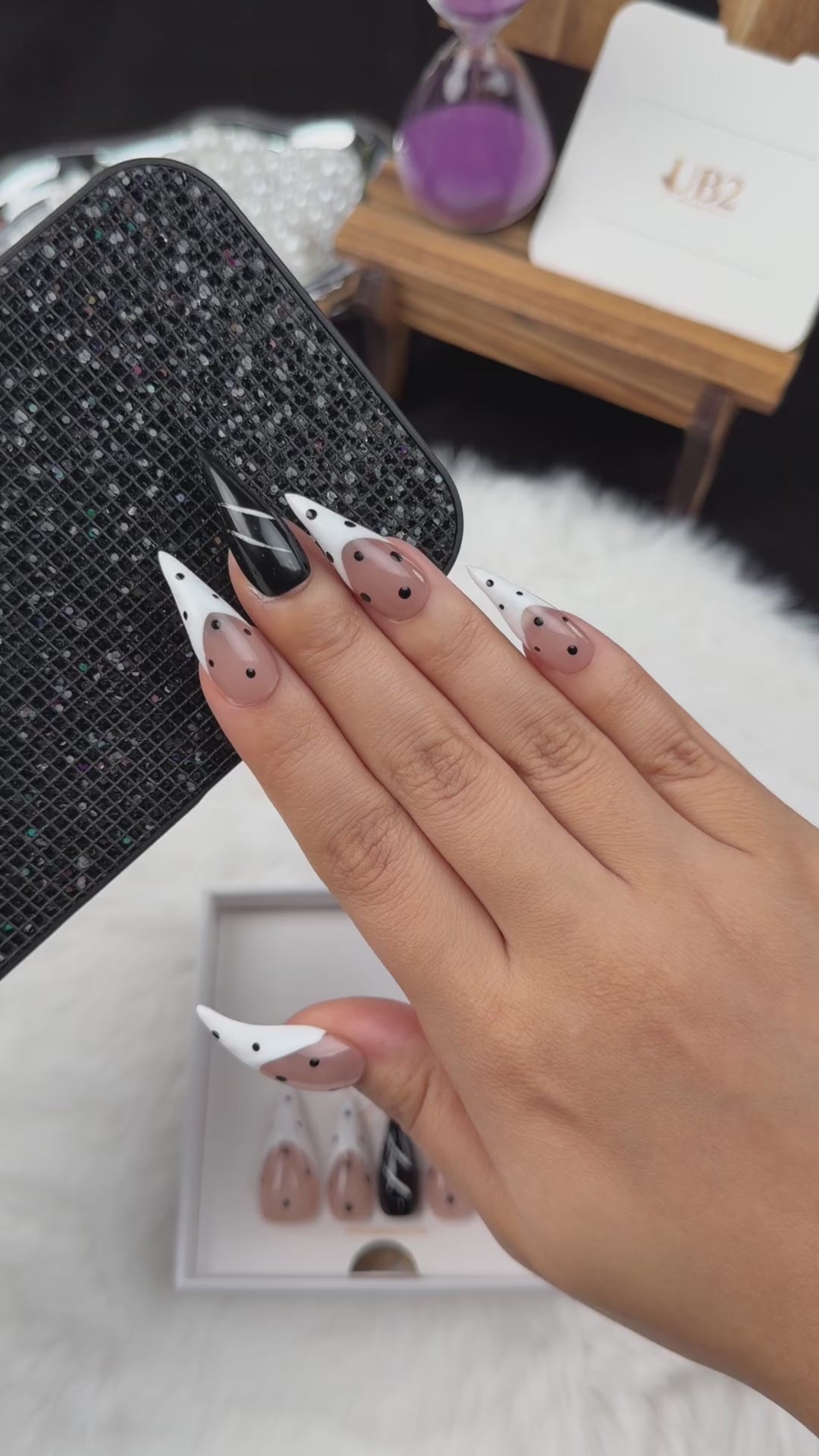Load video: Step-by-step application of Ink Dots black and white polka dot stiletto press-on nails