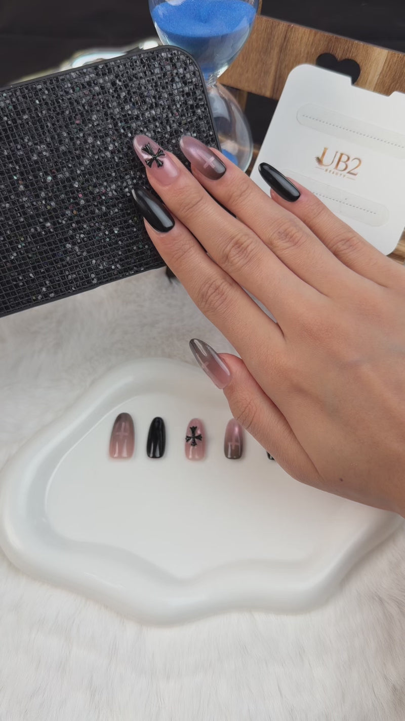 Step-by-step application of Shadow Cross black and smoky pink cross medium oval press-on nails