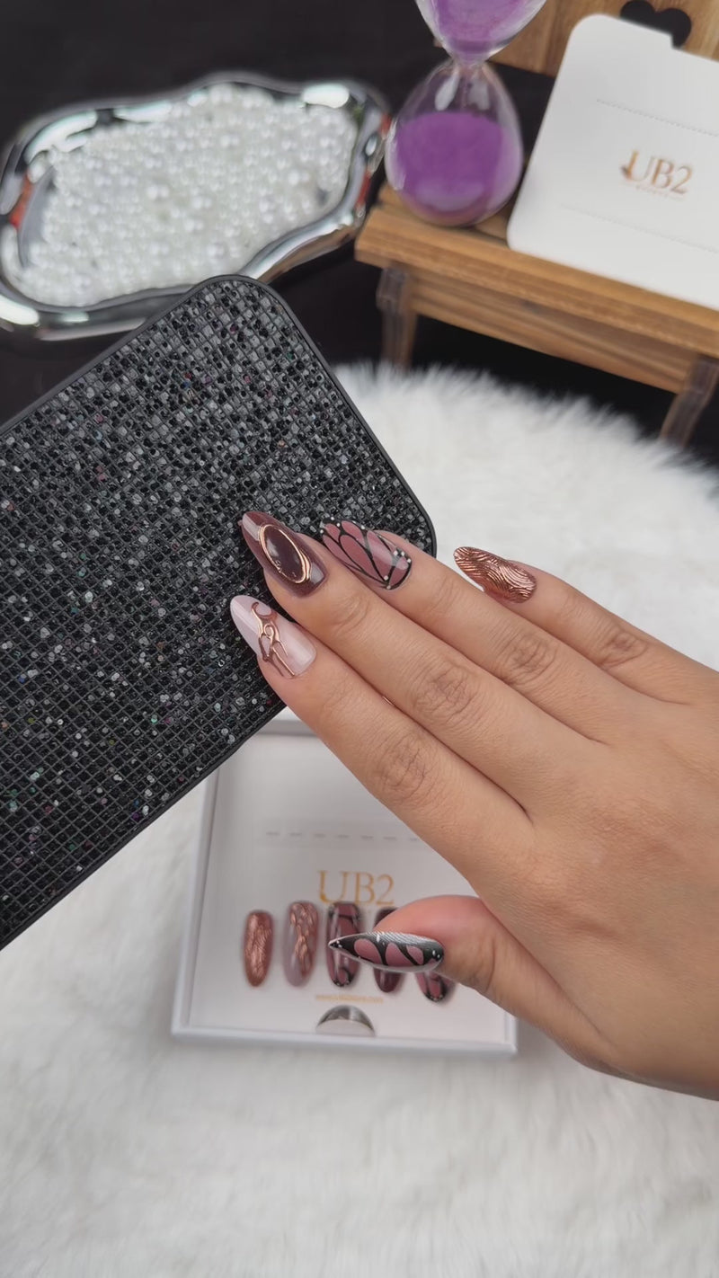 Step-by-step application of Copper Wings brown and copper butterfly wing almond press-on nails