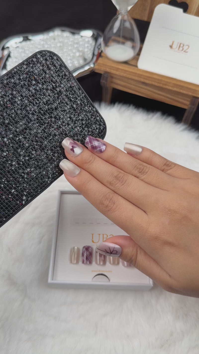 Step-by-step application of Ribbon Plaid pearl white and plum bow and plaid square press-on nails
