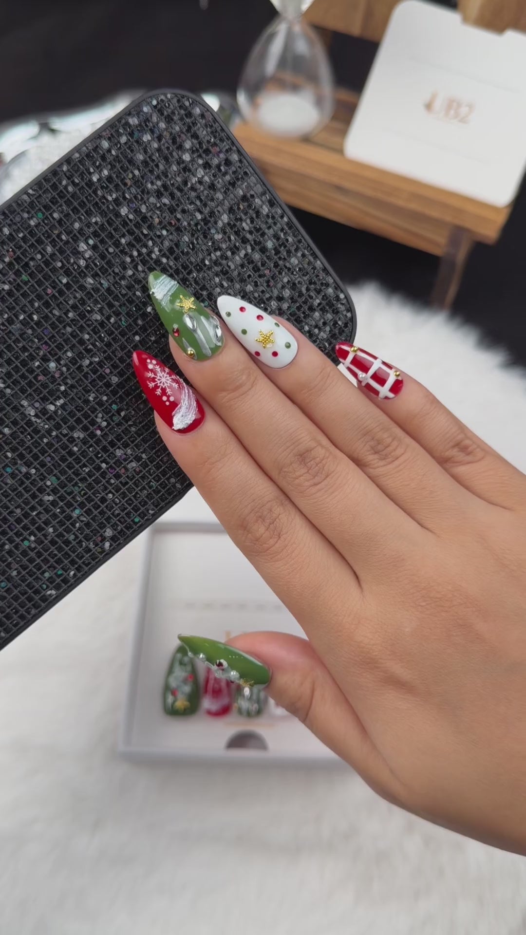 Load video: Step-by-step application of Winter Parcel red and green ribbon and plaid Christmas almond press-on nails