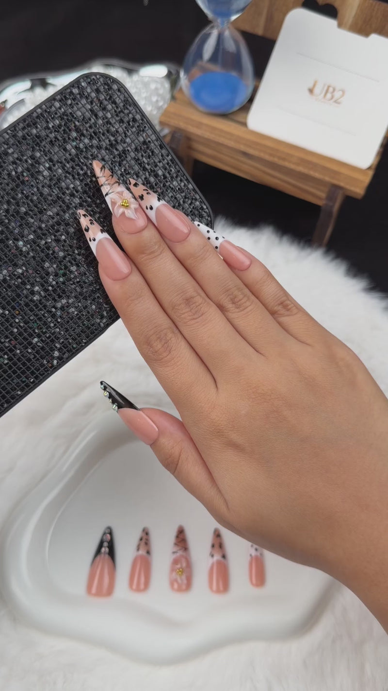 Step-by-step application of Noir Detail black and nude graphic French tip almond press-on nails
